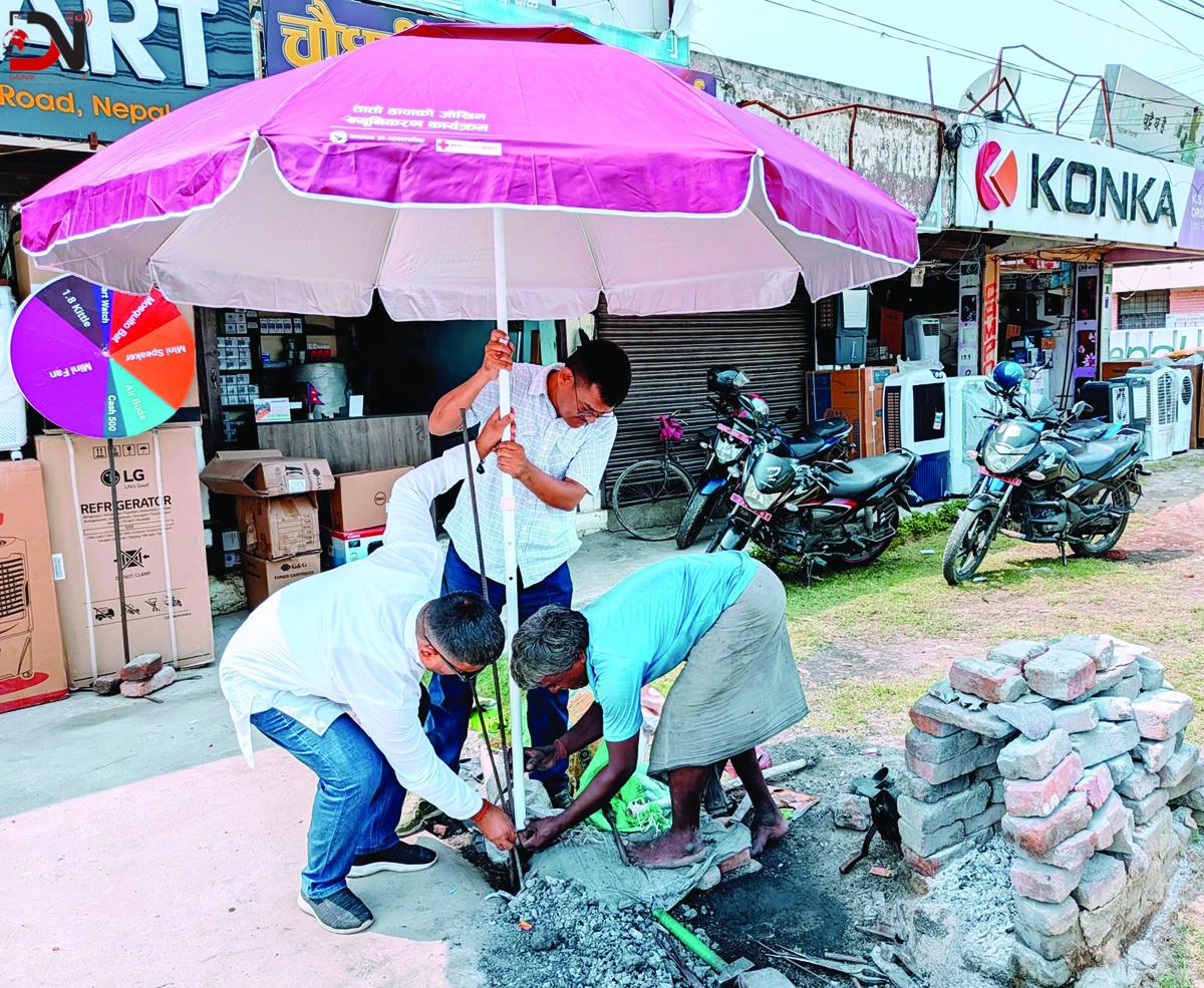 श्रमिकलाई छाता